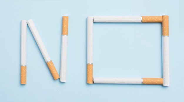 No text made with cigarettes against blue backdrop