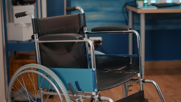 Nobody in living room with wheelchair to give mobility and support to people with chronic and physical disability. Wellness instrument used to help with transportation and accessibility.