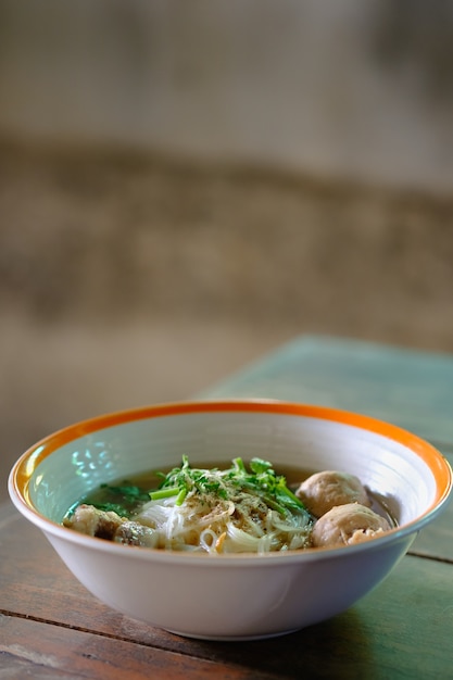 Noodle and soup in bowl put on the table