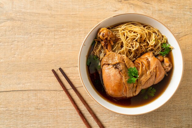 Noodles with Braised Chicken in Brown Soup Bowl - Asian food style