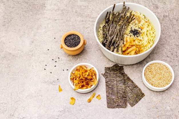 Noodles with seaweed, tuna flakes and sesame seeds