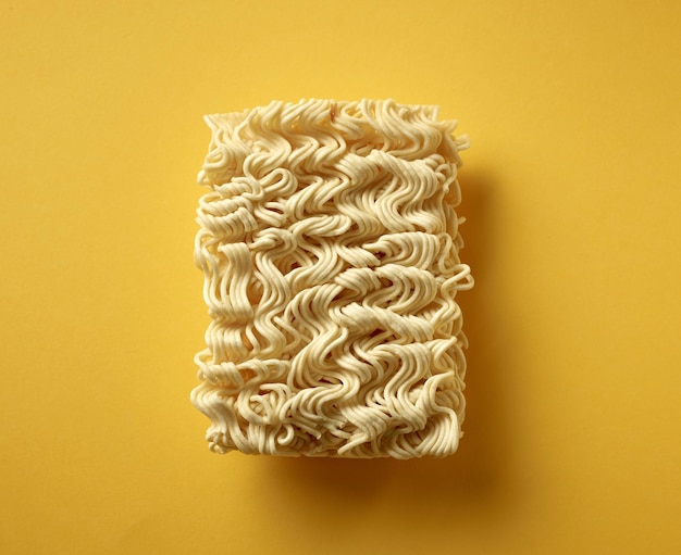 Photo noodles on yellow background