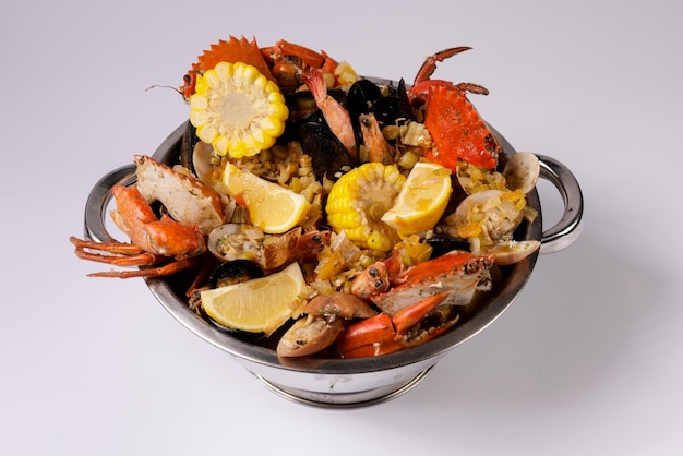 NORTH BEACH PREMIUM CLAWPINNO of fried fish prawn corn shellfish and crab top view on grey background singapore food