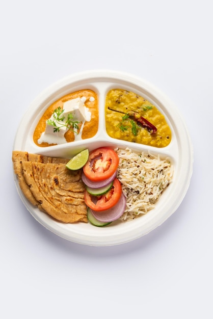 North Indian mini meal parcel platter or combo thali with paneer butter masala roti dal and rice