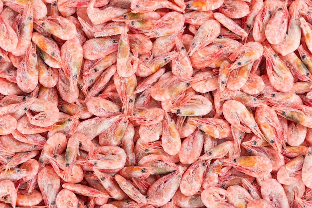 Northern deep sea wild shrimp Frozen boiled shrimp without glaze as a background