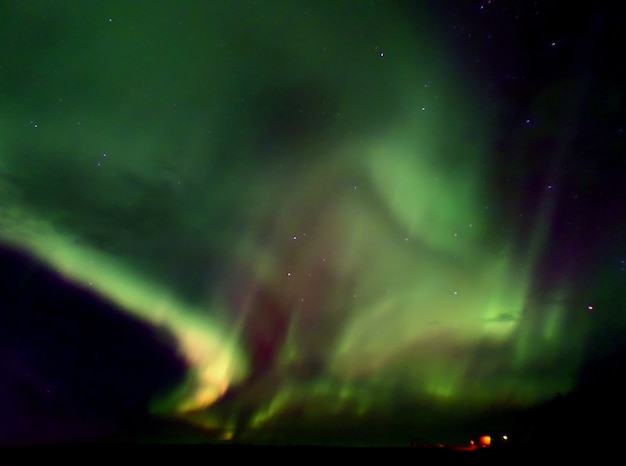 Northern Lights Flashing over the Glacier Lake in Vatnajokull National Park, South Iceland