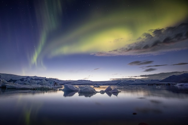 Northern lights over a glacial lake in Iceland Aurora borealis