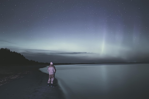 northern lights lonely man lakeside beautiful nature night sky landscape