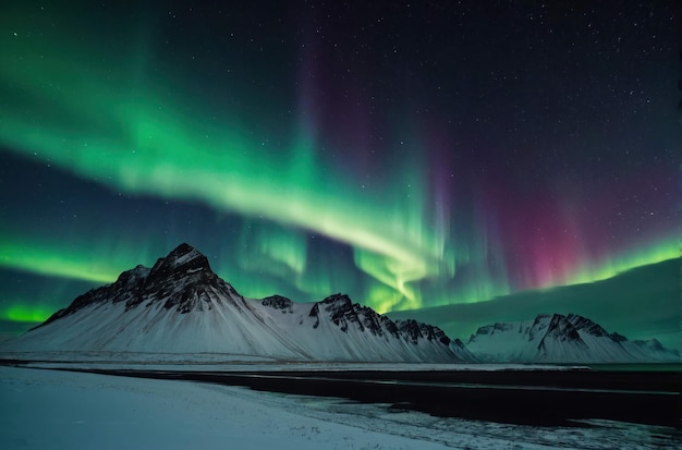 Northern Lights over Snowy Mountain Range