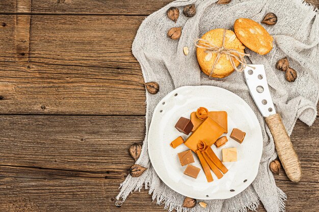 Norwegian brunost with cookies and nuts Healthy food and eating organic ingredient for breakfast