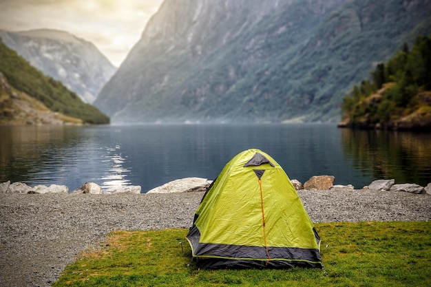 Norwegian fjord landscape with camping tent Norway adventure