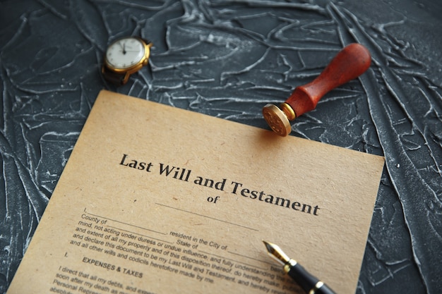 Photo notary's public pen and stamp on testament and last will. notary public tools