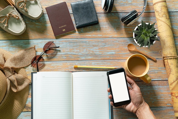 Note pad and mobile phone on the desk and coffee mug