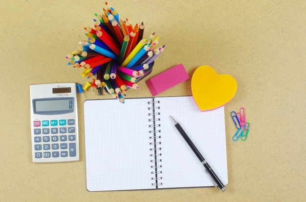 Notebook  and pen on wooden table