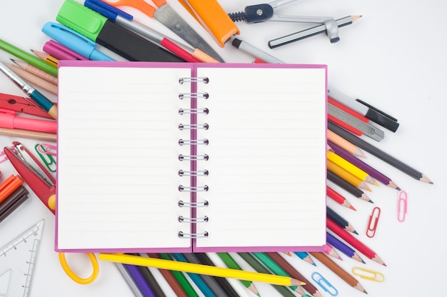 Notebook and school or office tools  on white background And 