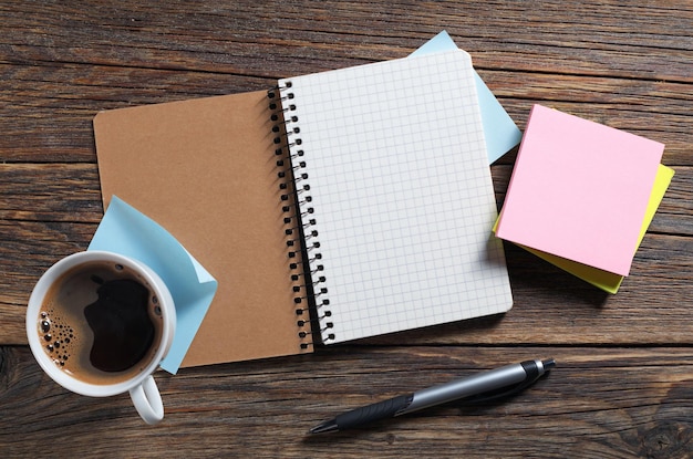 Notebook sticky notes and coffee