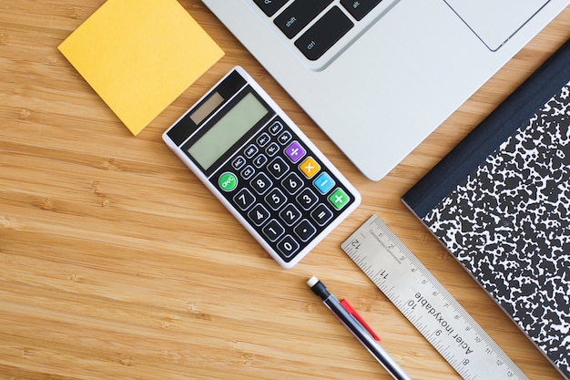 Notebook with notepad, calculator, pencil, ruler and schedule