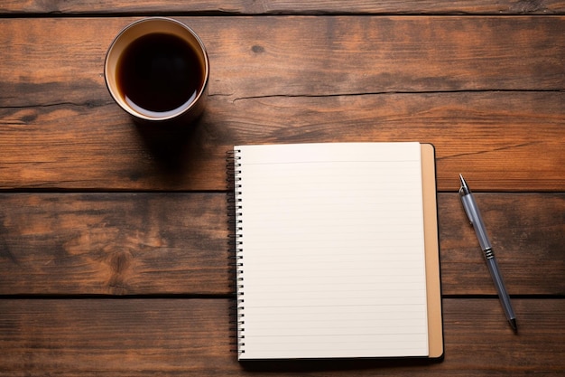 A notebook with a pen and a pen on a wooden table