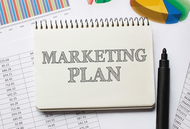 Notebook with Toolls and Notes about Marketing Plan