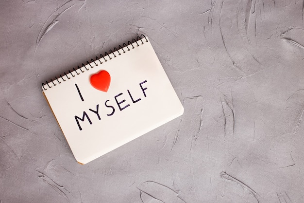 A notebook with a written phrase: I love myself. Concept of accepting myself.