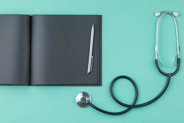 Notepad with stethoscope on the table