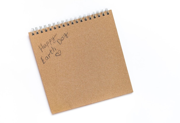 A notepad with the words happy earth day written on it