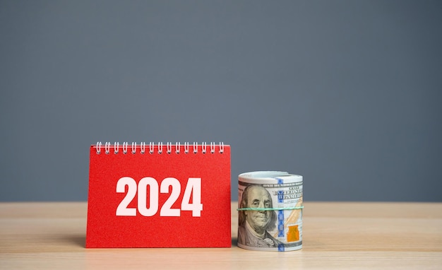 Notes 2024 and dollar bills Budget planning concept Financial goals and plans Business and finance Forecasting and analysis Investments strategy