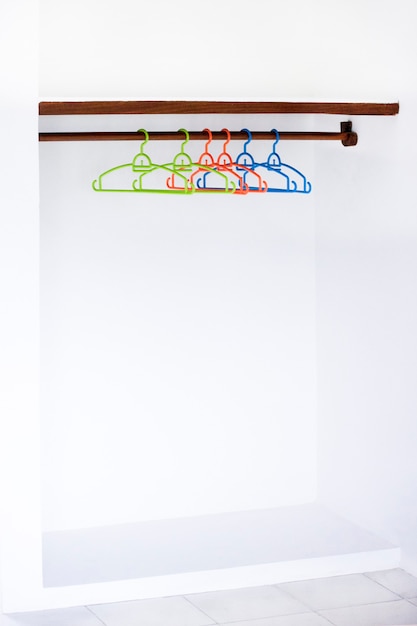 Nothing to wear design sale concept coat hanger on white wall copy space