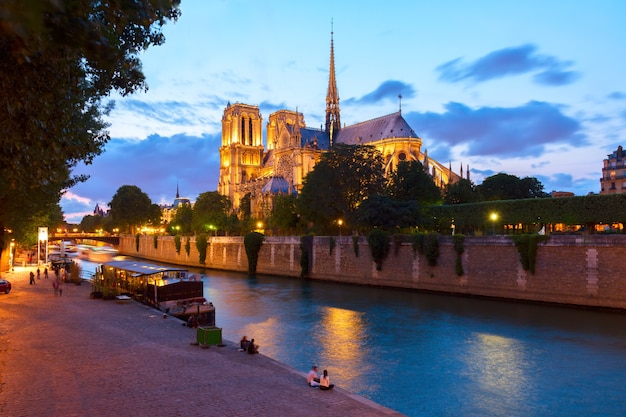 Notre Dame cathedral and Seine river at night, Paris, France