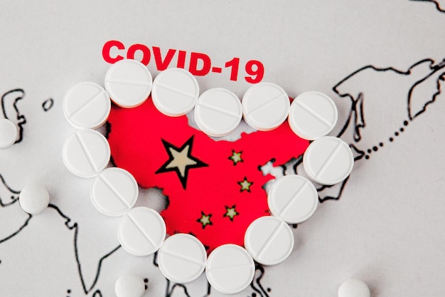 Photo novel coronavirus 2019 from wuhan china named covid19 epidemic danger prevention vaccine treatment concept face mask antibiotic pills syringes