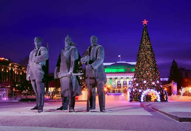 Novosibirsk Siberia Russia 01092022 Lenin Square in the night lights 3 granite statues