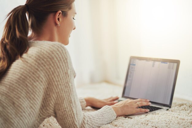 Nowadays online is the easiest way to find things Shot of a young blonde woman relaxing at home