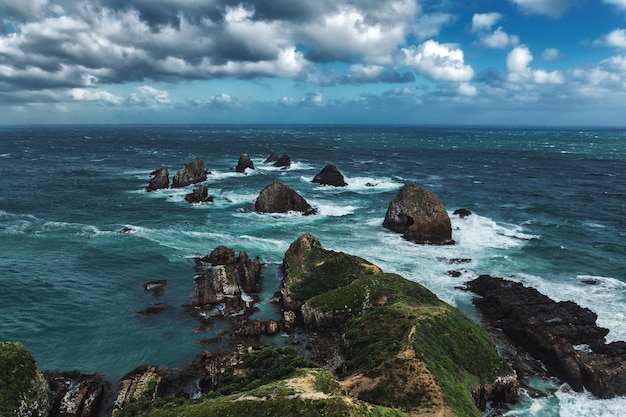 Nugget Point rock in the ocean in Otago, New Zealand