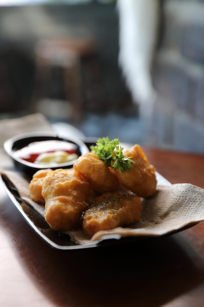 Nuggets on wood background vintage style , appetizer