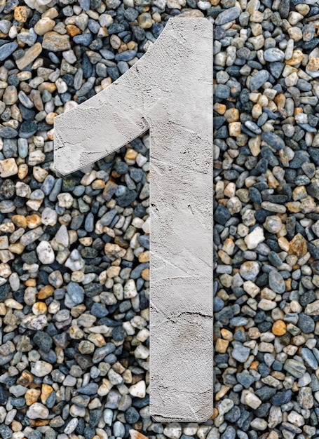 Number 1 with concrete texture on stones background