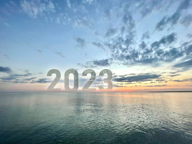 A number 2023 on the ocean water horizon as the sign of new year