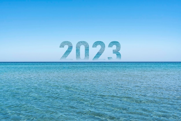 A number 2023 on the ocean water horizon as the sign of new year