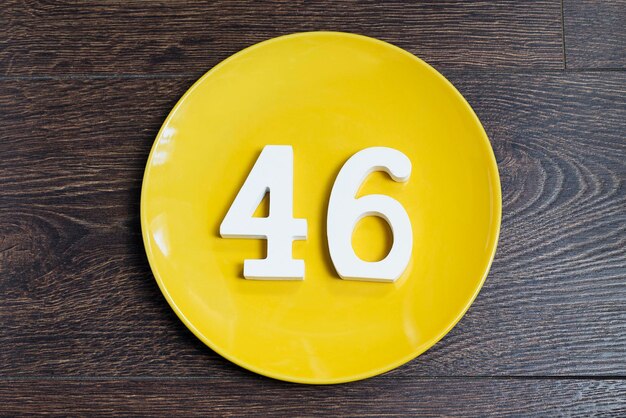 Number forty six on the yellow plate