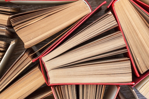 Number of old books. Used hardback books. View from above. Education background