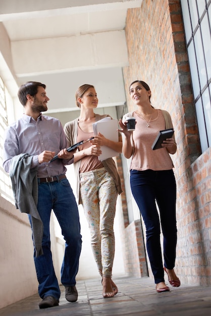 The number one team in the business Shot of three young colleagues in their office building