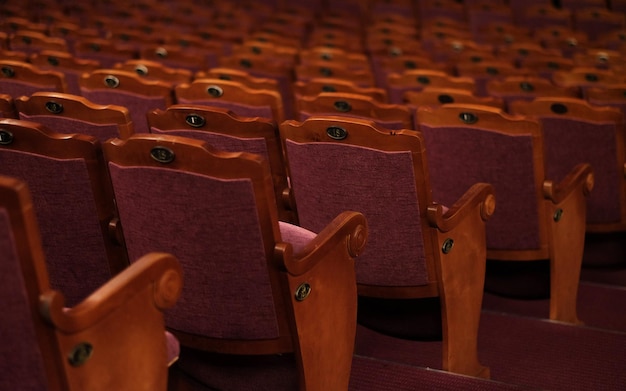 Numbered theater chairs with red velvet