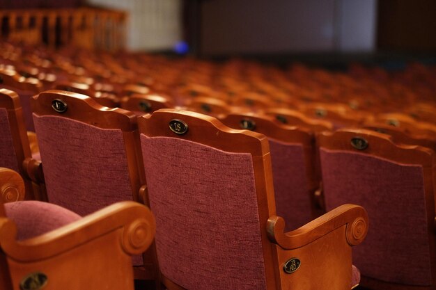 Numbered theater chairs with red velvet