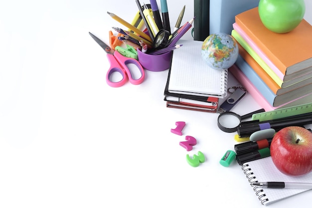 Numbers and school supplies on white background