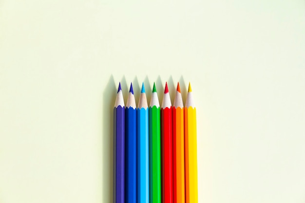 Numerous bright pencils for drawing in an album in drawing classes