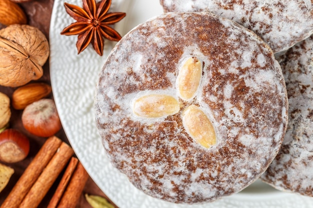 Nuremberg gingerbread with nuts almonds hazelnuts walnuts in sugar glaze Lebkuchen Traditional Christmas and new year treats Selective focus