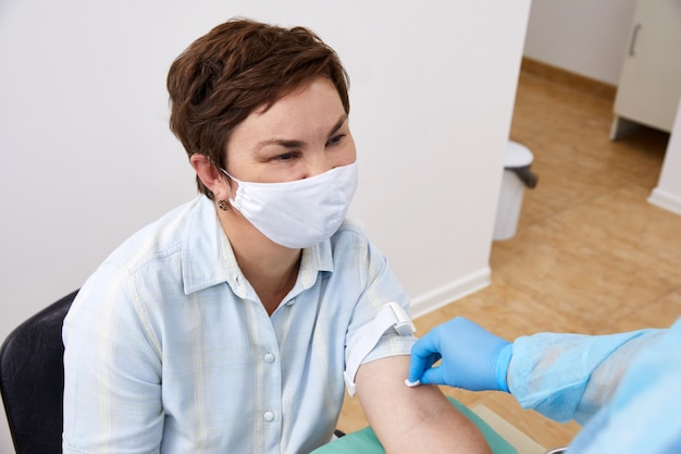 Nurse doing blood test from vein. Covid testing concept