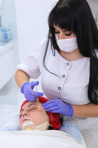 Nurse doing plasma injection