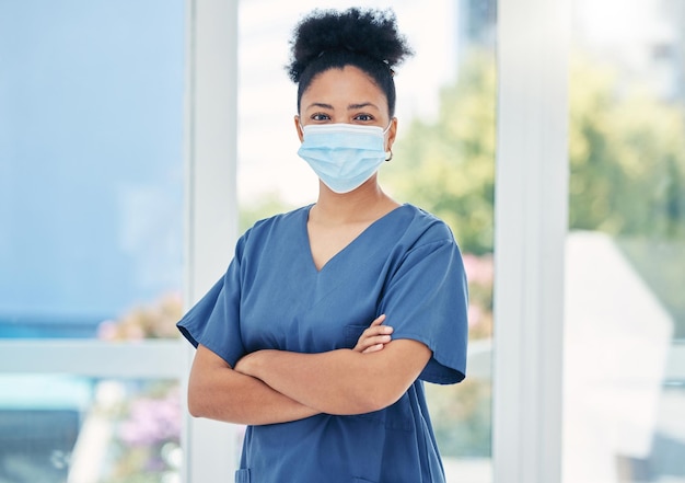 Nurse healthcare black woman with a covid face mask in confident portrait Innovation leadership and proud medical nursing professional surgeon or health employee with vision for success in career