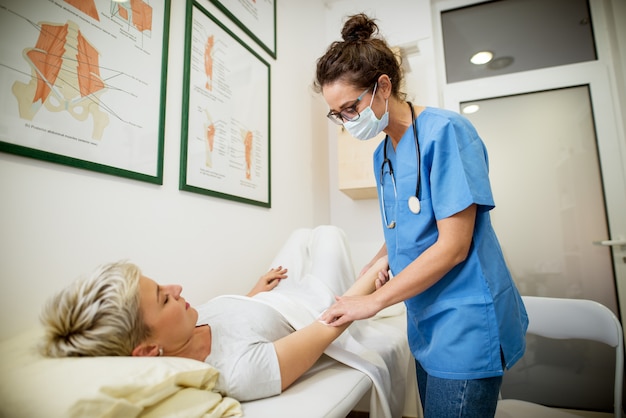 Nurse helping her patient.