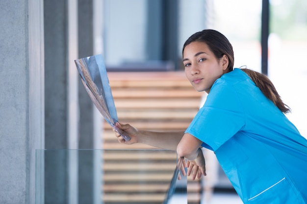 Nurse holding a X-ray report